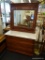 MARBLE TOP DRESSER; THREE DRAWER, CHERRY STAINED DRESSER WITH A WHITE MARBLE TOP, A SWIVEL MIRROR,