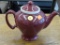 MCCORMICK TEAPOT; MAROON TEAPOT WITH WHITE INFUSER AND LID. HALLMARK STAMP ON BOTTOM READS