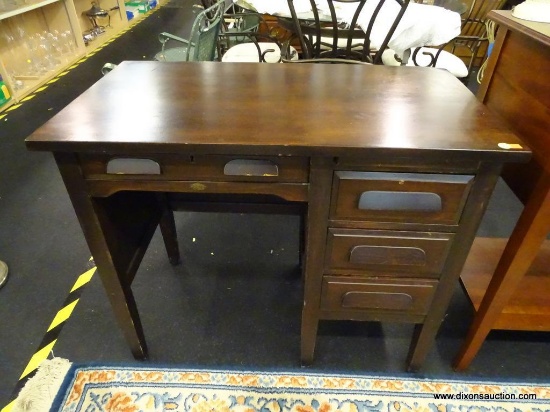 SMALL WOODEN SINGLE PEDESTAL STUDENT DESK; DARK STAINED, WITH CENTER DRAWER AND RIGHT 3 DRAWER