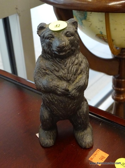 COIN BANK; VINTAGE CAST IRON BANK IN THE FORM OF A BLACK BEAR. MEASURES 6.5 IN TALL.