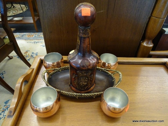 BAR SET; INCLUDES A LEATHER WRAPPED DECANTER WITH ORIGINAL STOPPER, 4 COPPER DRINKING CUPS, AND A