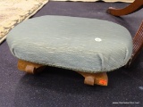 FOOT STOOL; GREEN UPHOLSTERED AND MAPLE FOOTSTOOL IN GOOD USED CONDITION. MEASURES 16 IN X 11 IN X 5