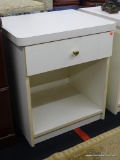 WOODEN SIDE TABLE; ONE DRAWER WITH GOLD COLORED KNOB. TOP HAS ROUNDED EDGES ON THE FRONT. MATCHES