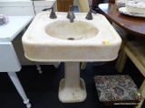 PORCELAIN SINK; ANTIQUE PORCELAIN PEDESTAL BASE SINK WITH BRONZE HARDWARE. IS IN VERY GOOD CONDITION