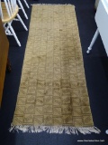 WOVEN WOOL RUNNER; TAN WITH LIGHT BROWN GEOMETRICAL DESIGN WITH OFF WHITE FRINGE. MEASURES 2 FT 9 IN