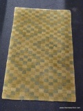 SMALL AREA RUG; KNECHT AG OF SWITZERLAND GREEN AND BEIGE CHECKERED AREA RUG. MEASURES 3 FT 1 IN X 2