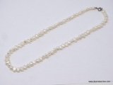 LADIES FRESHWATER PEARL NECKLACE; 18 IN STRAND OF FRESHWATER PEARLS WITH .925 CLASP.