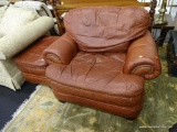 BROYHILL BROWN LEATHER CHAIR & A HALF; INCLUDES MATCHING OTTOMAN. BRASS STUDDING ACCENTS. PLUSH ARM