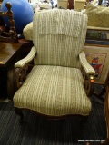 VINTAGE ARMCHAIR; FEATURES CREAM UPHOLSTERY VERTICALLY STRIPED WITH GREEN, MAROON, PINK, AND LIGHT