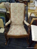 VINTAGE ROCKING CHAIR; FEATURES CREAM UPHOLSTERY WITH MAROON, PINK, GREEN, AND GOLD FLORAL DESIGNS