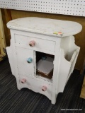 VINTAGE CHILD'S SIDE TABLE; HAS 1 DRAWER OVER 2 DOORS OVER 1 DRAWER WITH 2 SIDE MAGAZINE HOLDERS ON