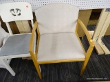 JOFCO CHAIR; FEATURES AN OAK FRAME WITH CREAM COLORED, GEOMETRIC PRINT UPHOLSTERY. MEASURES 23 IN X