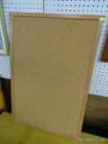 BULLETIN BOARD; FEATURES A WOODEN FRAME. HAS MINOR DAMAGE TO CORK BOARD DUE TO TACKS. MEASURES 36 IN