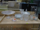 PARTIAL SHELF LOT OF GLASSWARE; INCLUDES A CAKE PLATTER, A SET OF DESSERT PLATES, A PITCHER, AND