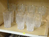 PARTIAL SHELF LOT OF DRINKING GLASSES; INCLUDES A SET OF 4 CUT-GLASS DRINKING GLASSES WITH GOLD