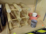 PARTIAL SHELF LOT OF ASSORTED DECOR; INCLUDES A 4 BOTTLE WINE RACK, 3 CANDLES, AND A DOUBLE-HANDLED