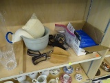 PARTIAL SHELF LOT OF ASSORTED HOUSEHOLD ESSENTIALS; INCLUDES HOT AND COLD PACKS, A MICROWAVEABLE