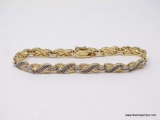 GOLD TONE AND CZ BRACELET; LADIES 8 1/5 IN TENNIS BRACELET WITH CZ STONES.