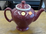 MCCORMICK TEAPOT; MAROON TEAPOT WITH WHITE INFUSER AND LID. HALLMARK STAMP ON BOTTOM READS