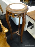 MARBLE TOP PLANT STAND; FEATURES A CIRCULAR BEVELED TOP WITH A CREAM COLORED MARBLE INLAY AND A