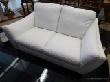 WHITE LEATHER LOVE SEAT; HAS ATTACHED CUSHIONS AND BLACK PAINTED LEGS AND IS IN VERY GOOD CONDITION!