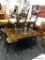 DROP LEAF DINING TABLE AND CHAIRS; INCLUDES A MAHOGANY DROP LEAF TABLE WITH TWO 12 IN LEAVES AND 4