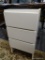 THREE DRAWER CABINET; WHITE CABINET WITH THREE FLAT FACE DRAWERS. IS MISSING TOP, BUT WOULD MAKE A