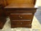 WOODEN NIGHT STAND; 2 DOVETAIL DRAWERS WITH METAL HANDLES. SITS ON BRACKET FEET. MATCHES LOTS # 16,