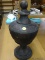 DECORATIVE URN; BRUSHED BLACK AND COPPER DECORATIVE URN. MEASURES 7.5 IN X 15 IN.