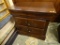 WOODEN NIGHT STAND; 2 DOVETAIL DRAWERS WITH METAL HANDLES. SITS ON BRACKET FEET. MATCHES LOTS #16,