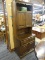 VINTAGE STEP BACK CUPBOARD; FEATURES AN UPPER SHELF ABOVE TWO CABINET DOORS THAT OPEN TO REVEAL A