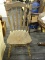 ARROW-BACK WINDSOR DINING CHAIR; FEATURES AN UNPAINTED RUSTIC LOOK WITH TURNED LEGS. THIS WOULD BE A