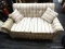 STRIPE UPHOLSTERED LOVESEAT; FEATURES BLUE, PINK, AND CREAM STRIPED UPHOLSTERY WITH A BUTTON TUFTED