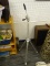 LARGE TRIPOD; IS MADE OF METAL WITH TELESCOPING LEGS AND ADJUSTABLE ANGLE HEAD. MEASURES 56 IN TALL.