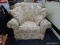 ROWE ROCKING CHAIR; ROWE WHITE UPHOLSTERED ROCKING CHAIR WITH FLORAL AND LEAF PATTERN SLIPCOVER. HAS