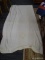 KNIT BLANKET; CREAM COLORED KNIT BLANKET WITH SATIN EDGES. MEASURES 6 FT 7 IN X 7 FT 4 IN.