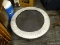 MINIATURE TRAMPOLINE; MINI TRAMPOLINE WITH SILVER PADDING AROUND EDGES. MEASURES 36 IN X 9 IN.