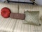 DECORATIVE PILLOWS; INCLUDES A RED ROUND PILLOW WITH CENTER BUTTON, A BROWN LUMBAR PILLOW, AND A