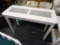 FARM CHIC CONSOLE TABLE; HAS 2 GLASS PANELS ON THE TOP AND A WHITE CHIPPY FINISH. IS IN VERY GOOD