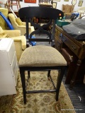 BAR STOOL; MADE BY LEGACY FURNITURE. FEATURES A BLACK WOODEN FRAME WITH A BEIGE AND BLACK