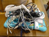 WII ACCESSORIES; INCLUDES A WII FIT BOARD WITH TURQUOISE SILICONE CASE, A BASEBALL BAT, GOLF CLUB,