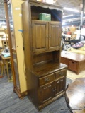 VINTAGE STEP BACK CUPBOARD; FEATURES AN UPPER SHELF ABOVE TWO CABINET DOORS THAT OPEN TO REVEAL A