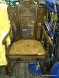 ANTIQUE TRIPLE PANEL CANE WINGBACK CHAIR; WOODEN CARVED FRAME WITH PATTERNED CREST, 3 PANELED BACK