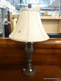 TABLE LAMP; FEATURES A DECORATIVE METAL FINIAL, BELL SHAPE TEXTURED TAUPE LAMP SHADE, LEAF DETAILS,