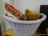 WICKER LAUNDRY BASKET WITH ACCENT PILLOWS; LIGHT PURPLE WICKER LAUNDRY BASKET FULL OF ACCENT