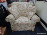 ROWE ROCKING CHAIR; ROWE WHITE UPHOLSTERED ROCKING CHAIR WITH FLORAL AND LEAF PATTERN SLIPCOVER. HAS