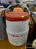 IGLOO COOLER; IGLOO RED AND WHITE COOLER WITH DISPENSER SPOUT ON THE FRONT. MEASURES 10 IN X 17 IN.