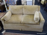 YELLOW LOVESEAT; FEATURES YELLOW, VELVET UPHOLSTERY WITH TWO ARM PILLOWS AND RAISED BORDER ON BACK