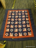 SONOMA PATRIOT QUILT; DECORATIVE NAVY BLUE QUILT WITH RED, WHITE, AND BLUE PATRIOTIC THEMED SQUARES