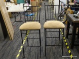 SET OF BARSTOOLS; SET OF 2 BLACK METAL FRAME WITH CUSHIONED TAN MICROFIBER SEATS. SITS ON BLACK